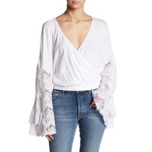 Bell sleeve lace surplus top